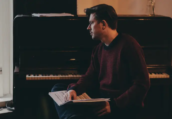 Pavel Szabo with sheet music at the piano